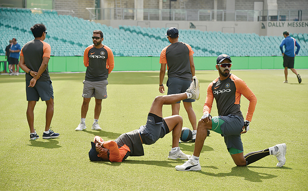 SYDNEY: India's players warm up before a training session ahead of the fourth and final Test against Australia at the Sydney Cricket Ground in Sydney yesterday. - AFP