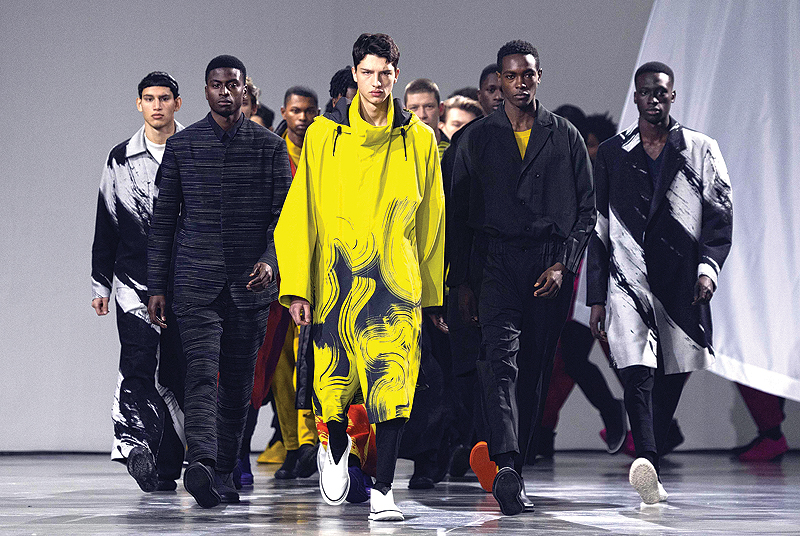 Models present creations by Issey Miyake Men during the men’s Fall/Winter 2019/2020 collection fashion show.