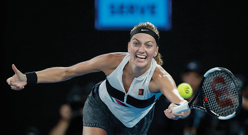 MELBOURNE: Czech Republic's Petra Kvitova plays a forehand return to Australia's Ashleigh Barty during their women's singles quarter-final match on day nine of the Australian Open tennis tournament in Melbourne yesterday. - AFP