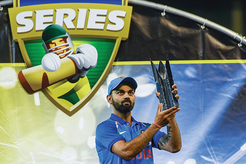 MELBOURNE: In this file photo taken on January 18, 2019 India's captain Virat Kohli holds up the team's one-day international series trophy after defeating Australia at the Melbourne Cricket Ground in Melbourne. India captain Virat Kohli yesterday became the first ever player to clinch all three top honours including cricketer of the year in the International Cricket Council awards. - AFP