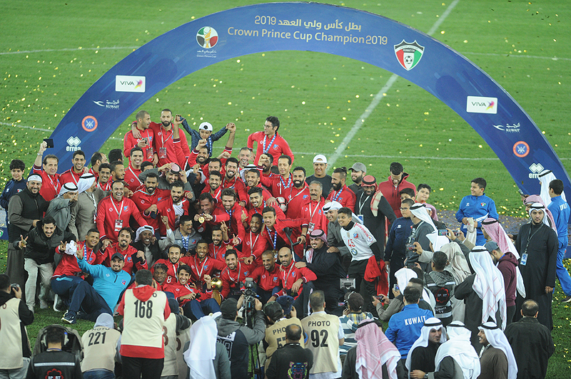 KUWAIT: Kuwait SC players celebrate their victory after winning His Highness the Crown Prince Football Cup in Kuwait yesterday. - Photo by Yasser Al Zayyat