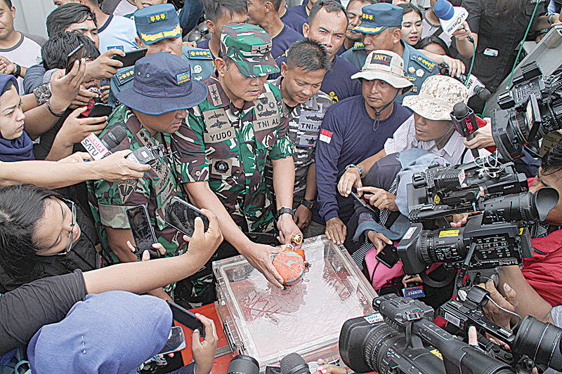 A cockpit voice recorder, the second “black box” from Lion Air flight 610 that crashed last October killing all 189 people onboard, is displayed to the media by Indonesian Navy personnel after the device’s recovery at sea off the coast of Karawang. —AFP