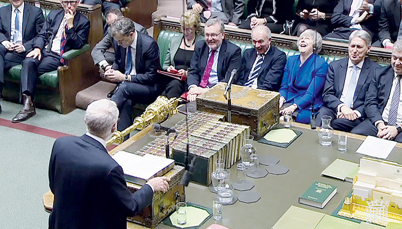 LONDON: A video grab from footage broadcast by the UK Parliament’s Parliamentary Recording Unit (PRU) shows Britain’s Prime Minister Theresa May (3R) reacting as opposition leader Jeremy Corbyn (bottom L) suggests she has been ‘acting in the interests of her own Party’, whilst he moves a motion of “No Confidence” against the Government, in the House of Commons. —AFP