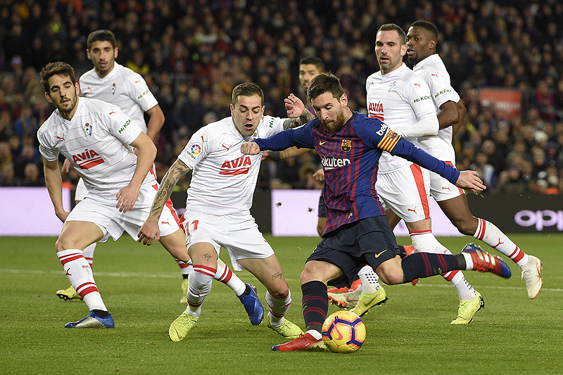 BARCELONA: Barcelona's Argentinian forward Lionel Messi shoots to score his team's second goal during the Spanish League football match between FC Barcelona and SD Eibar at the Camp Nou stadium in Barcelona on Sunday. Lionel Messi scored his 400th goal in La Liga against Eibar. – AFPn