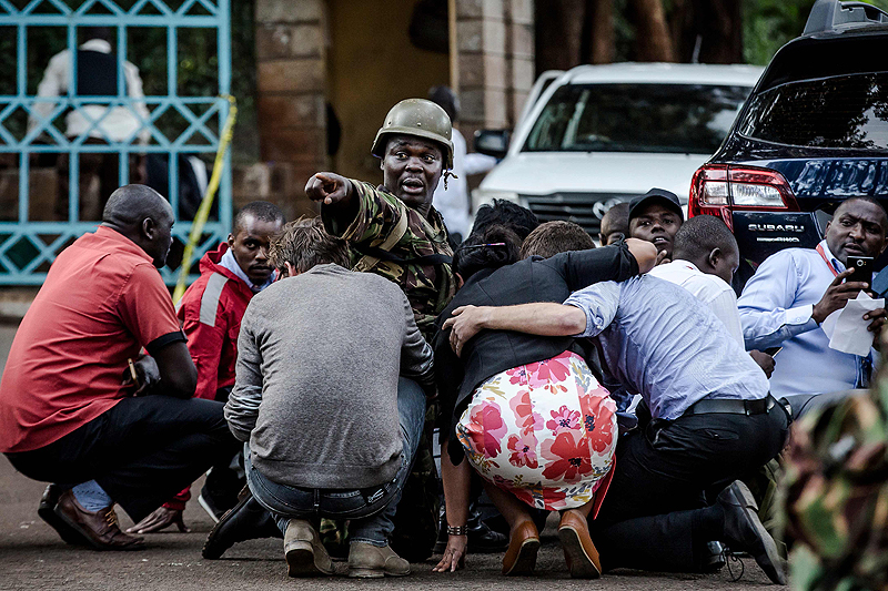 NAIROBI: Special forces protect people at the scene of an explosion at a hotel complex in Nairobi's Westlands suburb yesterday. - AFP