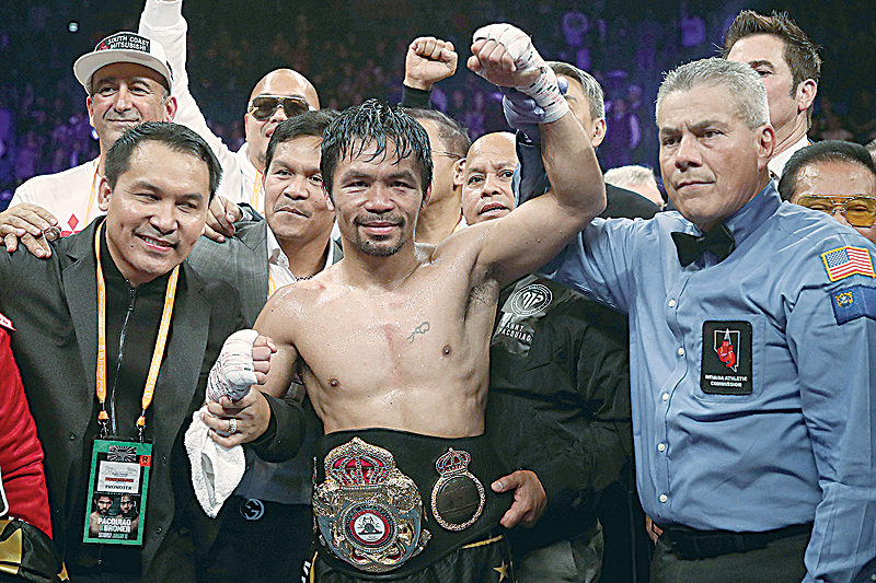 LAS VEGAS: Manny Pacquiao celebrates after defeating Adrien Broner by unanimous decision during the WBA welterweight championship at MGM Grand Garden Arena on Saturday in Las Vegas, Nevada. - AFP