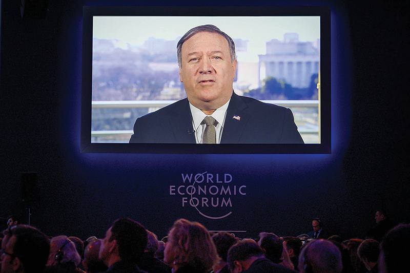 DAVOS: US Secretary of State Mike Pompeo is seen on a screen during his address via satellite at the World Economic Forum (WEF) yesterday. — AFP