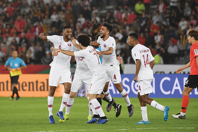 ABU DHABI: File photo shows Qatar's players celebrate their victory during the 2019 AFC Asian Cup quarter-final football match between South Korea and Qatar at Zayed Sports City in Abu Dhabi on January 25, 2019.  - AFP