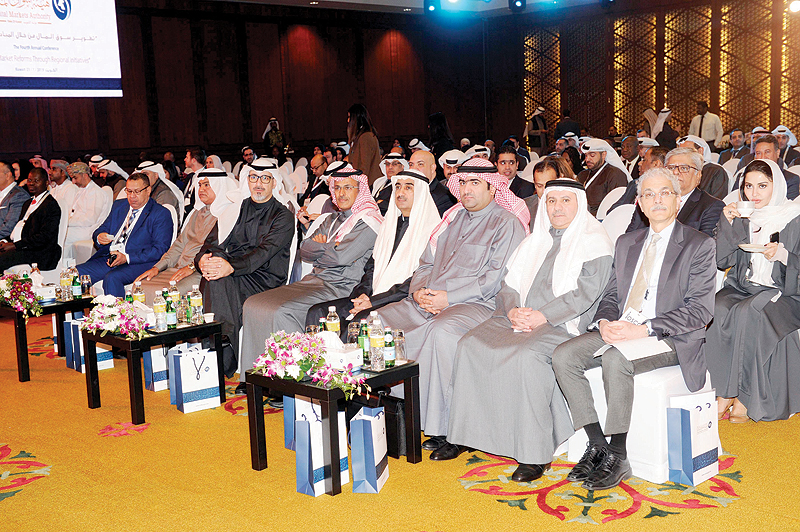 KUWAIT: Minister of Commerce and Industry Khaled Al-Roudhan, Vice Chairman of CMA Board of Commissioners Othman Al-Issa and other officials attend the fourth annual conference titled “Capital Market Reforms Through Regional Initiatives” held at the Jumeirah Messilah Hotel and Spa yesterday. — Photo by Yasser Al-Zayyat