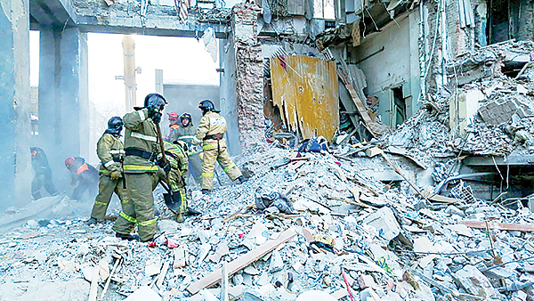 MOSCOW: This handout photograph shows rescuers taking part in a search operation three days after a gas explosion rocked a residential building in Russia’s Urals city of Magnitogorsk.—AFP