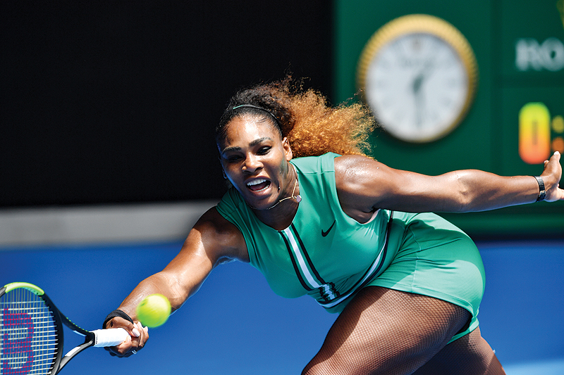 MELBOURNE: Serena Williams of the US hits a return against Germany’s Tatjana Maria during their women’s singles match on day two of the Australian Open tennis tournament in Melbourne yesterday. — AFP