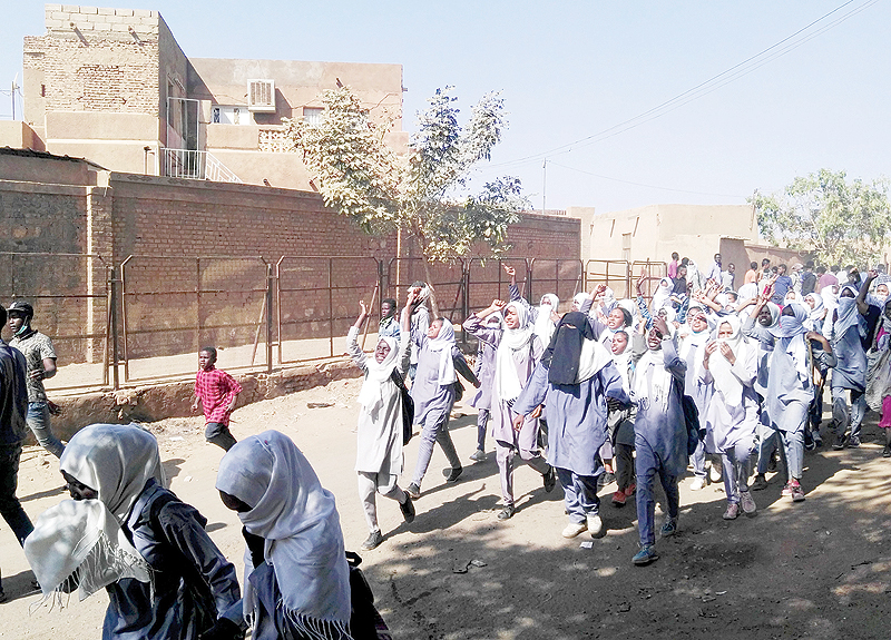 OMDOURMAN: Sudanese school girls join an anti-government protest in Khartoum’s twin city Omdurman on the west bank of the Nile river. —AFP