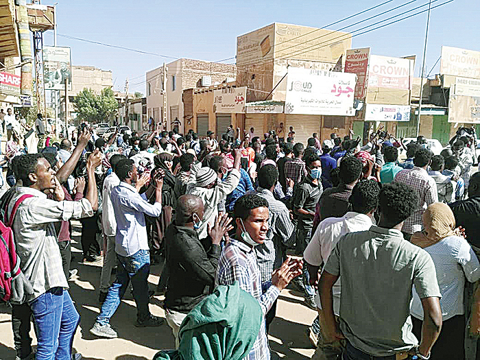KHARTOUM: Sudanese protesters chant slogans during an anti-government demonstration. —AFP