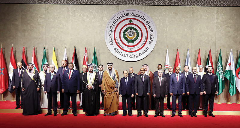 BEIRUT: Lebanese President Michel Aoun and Amir of Qatar Tamim bin Hamad Al-Thani pose for a picture with other Arab leaders and officials at the opening session of the Arab Development, Economic and Social Summit yesterday. - AFP 