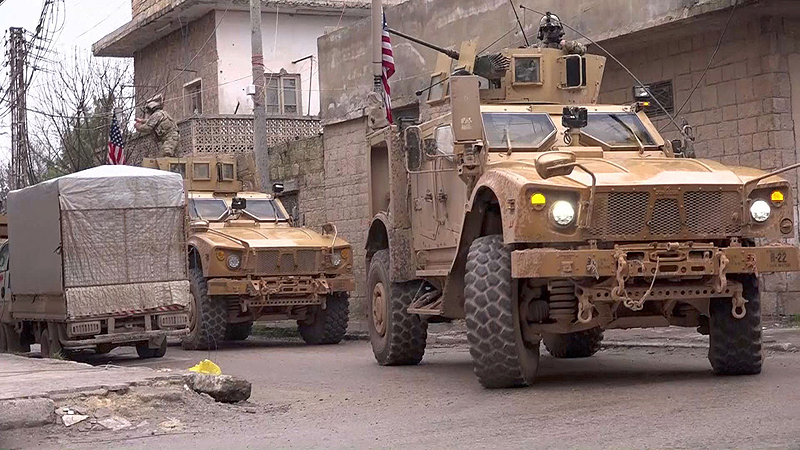 MANBIJ, Syria: An image grab taken from a video shows US armored vehicles at the scene of a suicide attack in this northern Syrian town yesterday. – AFP 