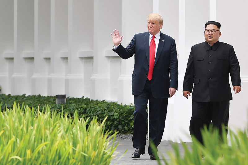 SINGAPORE: In this file photo taken on June 12, 2018 North Korea’s leader Kim Jong Un (R) walks with US President Donald Trump (L) during a break in talks at their historic US-North Korea summit, at the Capella Hotel on Sentosa Island. — AFP