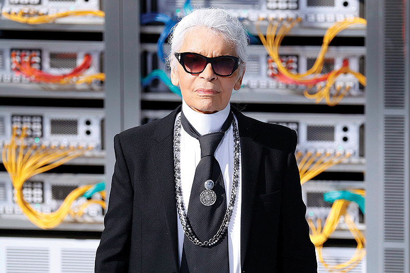 In this file photo German fashion designer Karl Lagerfeld acknowledges the audience at the end of the Chanel 2017 Spring/Summer ready-to-wear collection fashion show in Paris
