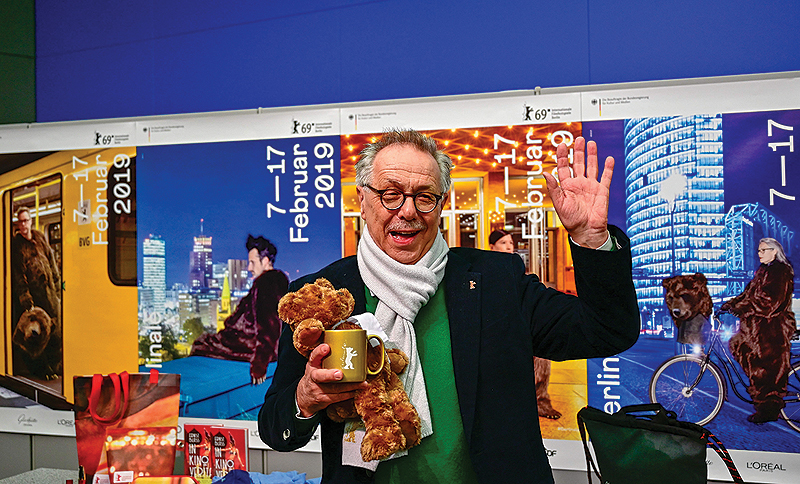 Outgoing Berlinale director Dieter Kosslick poses with Berlinale paraphernalia before giving a press conference in Berlin to present the program of the 69th Berlin film festival. This will be Kosslick’s last Berlinale as Director
