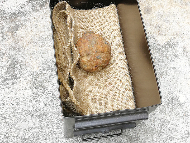 HONG KONG: This handout photograph taken on Saturday shows a World War I-era German hand grenade that was found among a shipment of French potatoes bound for a potato chips factory. - AFP 