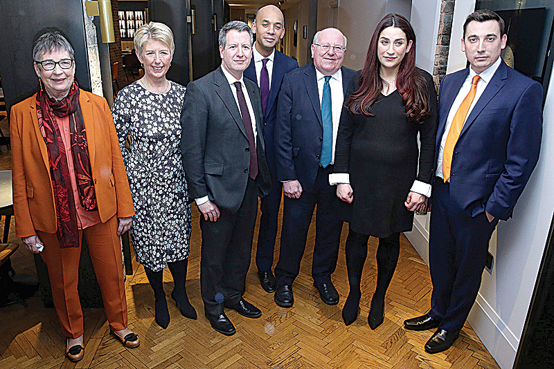 LONDON: Former Labor party MPs, (From Left) Ann Coffey, Angela Smith, Chris Leslie, Chuka Umunna, Mike Gapes, Luciana Berger, and Gavin Shuker pose for a photograph following a press conference in London yesterday, where they announced their resignation from the Labor Party, and the formation of a new independent group of MPs. —AFP