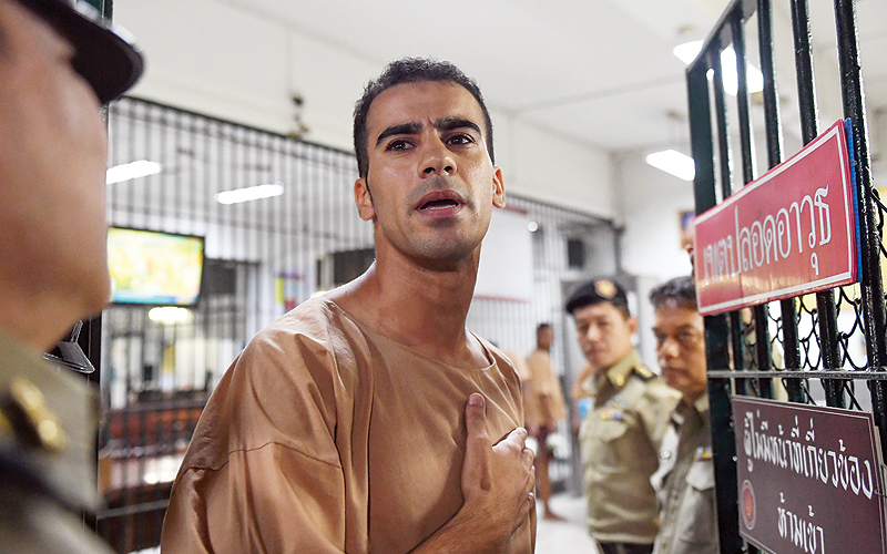 BANGKOK: Hakeem al-Araibi, a Bahraini refugee and Australian resident, is escorted to a courtroom in Bangkok yesterday. - AFPn
