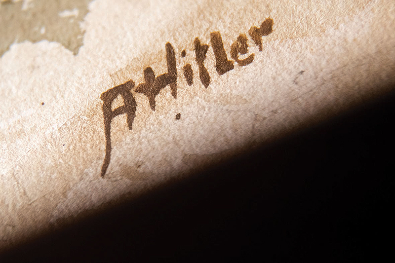 A picture shows the signature “AHitler” on a watercolour entitled “Im Wald” (In the forest) displayed at the Weidler auction house