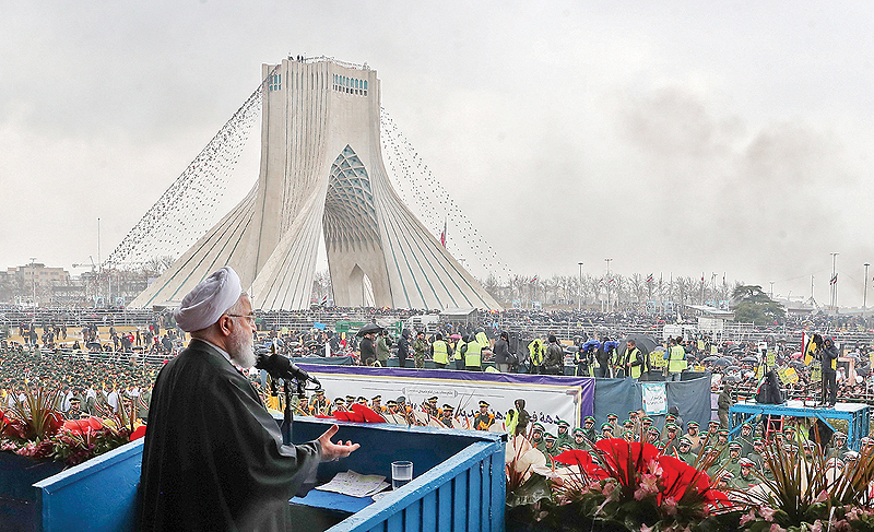 TEHRAN: Iranian President Hassan Rouhani addresses the crowd during a ceremony celebrating the 40th anniversary of the Islamic Revolution in Azadi (Freedom) Square yesterday. - AFP