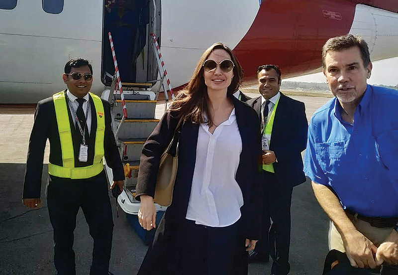 US actress and humanitarian Angelina Jolie arrives at the airport in Cox’s Bazar in southern Bangladesh yesterday. — AFP