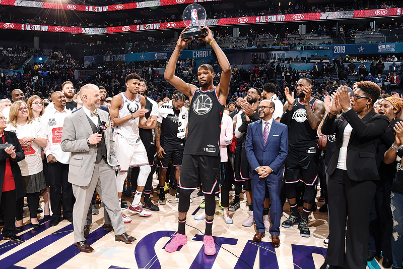 CHARLOTTE: Kevin Durant #35 of Team LeBron holds up the MVP trophy after the 2019 NBA All-Star Game on Sunday at the Spectrum Center in Charlotte, North Carolina. — AFP