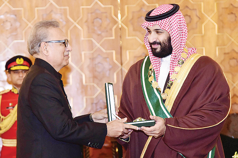 ISLAMABAD: Pakistani President Arif Alvi confers the country’s highest civilian award, the Nishan-e-Pakistan (Order of Pakistan), on Saudi Crown Prince Mohammed bin Salman at the President House yesterday. — AFP