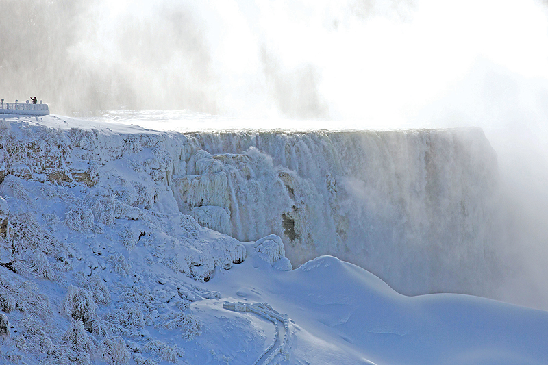 ONTARIO: A person takes a selfie beside on the US side of Niagara Falls as seen from Niagara Falls. - AFP 
