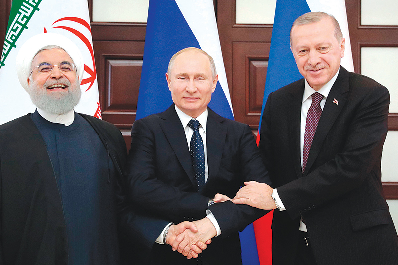 SOCHI: Russian President Vladimir Putin (center), Turkish President Recep Tayyip Erdogan (right) and Iranian President Hassan Rouhani pose prior to a trilateral meeting on Syria in the Black Sea resort of Sochi yesterday. - AFP 
