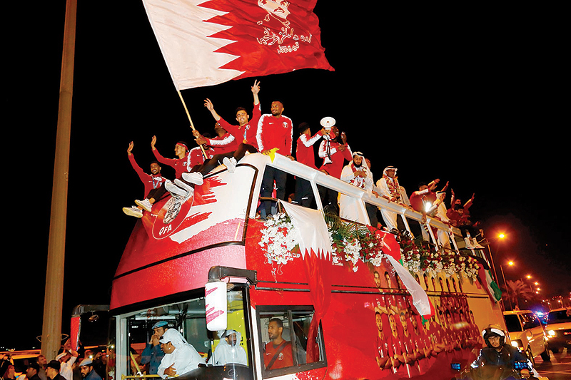 DOHA: Qatari national football team players and staff celebrate on the corniche on Feb 2, 2019 after they returned from the United Arab Emirates with the trophy after winning the 2019 AFC Asian Cup. — AFP