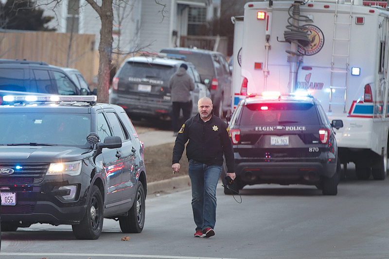 AURORA: Police secure the area following a shooting at the Henry Pratt Company. — AFP
