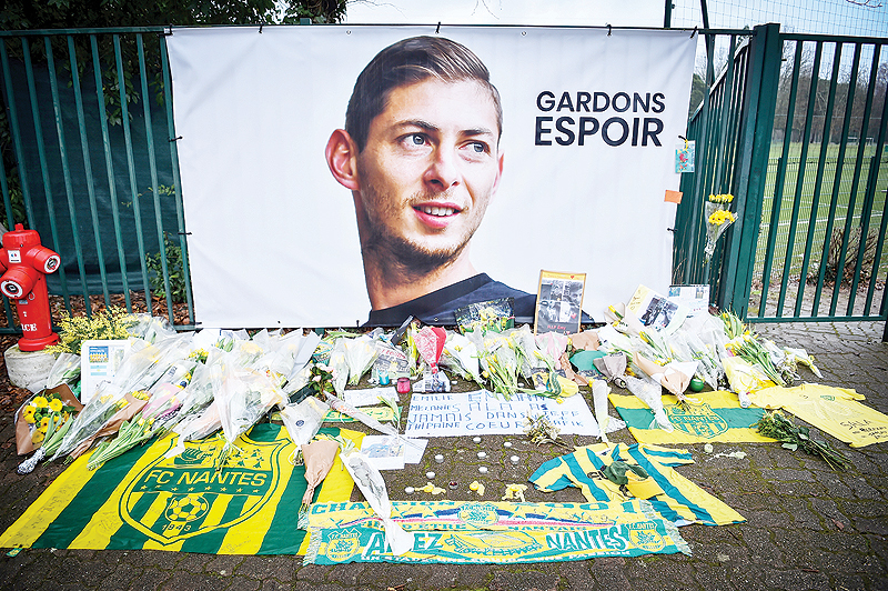 A picture shows flowers put in front of the entrance of the training center La Joneliere in La Chapelle-sur-Erdre on January 25, 2019, four days after the plane of Argentinean forward Emiliano Sala vanished during a flight from Nantes, western France. —AFP