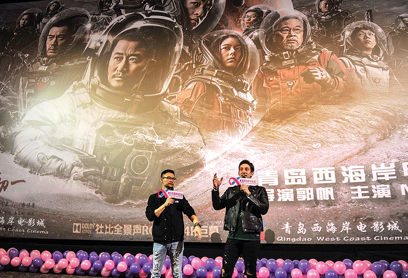 This photo shows film director Guo Fan, left, and American actor Michael Stephen Kai Sui attending a promotional event for Chinese sci-fi film “The Wandering Earth” in Qingdao in China’s eastern Shandong province. — AFP