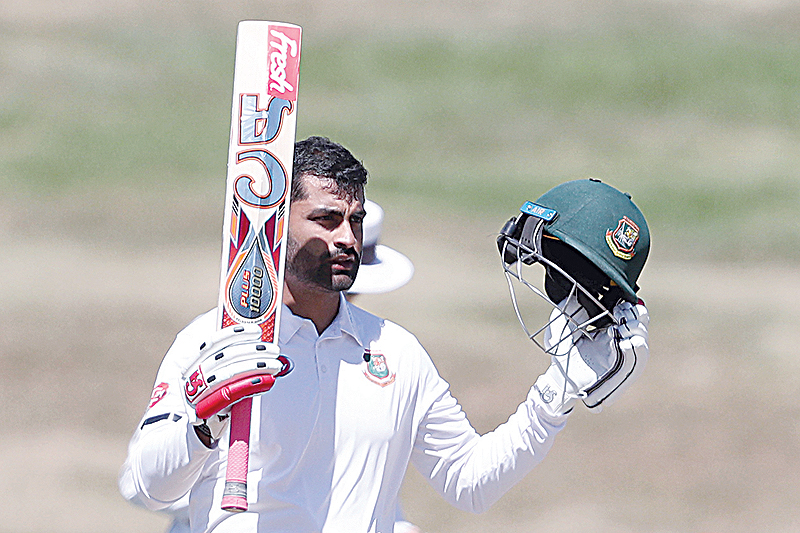 HAMILTON: Bangladesh's Tamim Iqbal celebrates his century during day one of the first cricket Test match between New Zealand and Bangladesh at Seddon Park in Hamilton yesterday. - AFPn