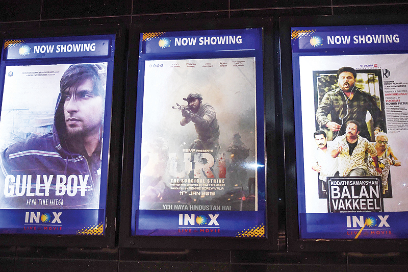 Posters of Bollywood movie 'Uri' are pictured at INOX Satyam multiplex in New Delhi yesterday.-AFP 
