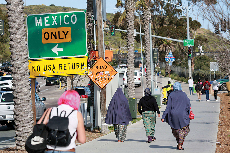CALIFORNIA: Pedestrians walk towards the US-Mexico border at the San Ysidro Port of Entry on in San Diego, California. President Donald Trump has threatened to close the United States border if Mexico does not stem the flow of illegal migrants trying to cross. — AFP