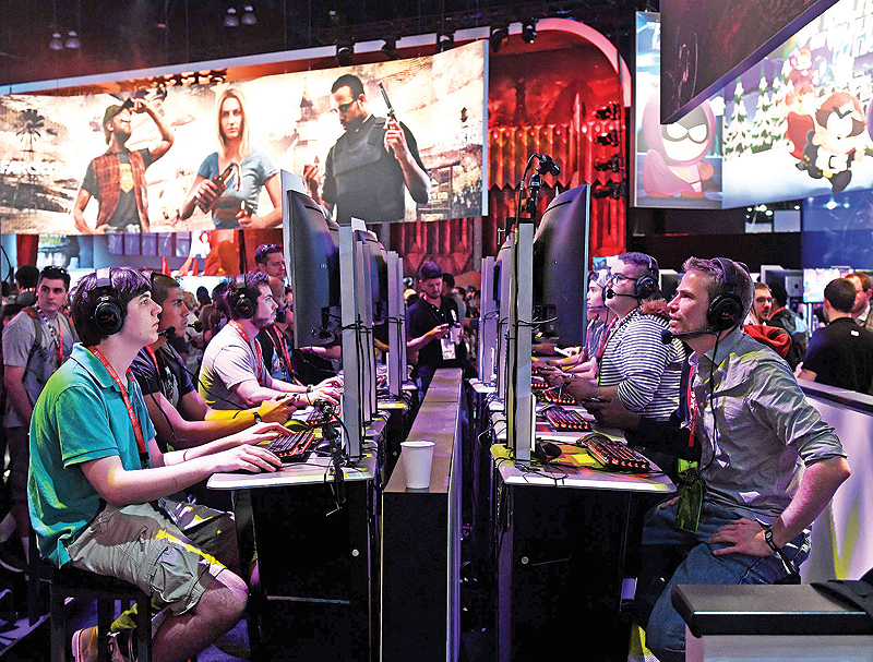 Gamers play the Ubisoft “Rainbow Siege” game at the Los Angeles Convention center on day one of E3 2017, the three-day Electronic Entertainment Expo, one of the biggest events in the gaming industry calendar, in Los Angeles, California.