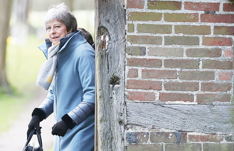 MAIDENHEAD: Britain’s Prime Minister Theresa May leaves after attending a church service, near her Maidenhead constituency, west of London yesterday. — AFP