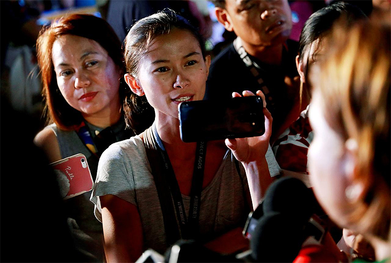 Rappler reporter Pia Ranada interviews Davao City Mayor Sara Duterte, the eldest daughter of President Rodrigo Duterte, after a campaign sortie in Calamba City, Laguna, Philippines, March 9, 2019. REUTER