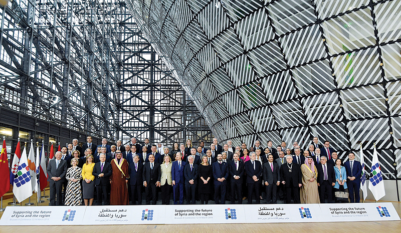 BRUSSELS: Officials pose for a photograph during the third Brussels conference on ‘supporting the future of Syria and the region’ at the European Council in Brussels yesterday. — AFP