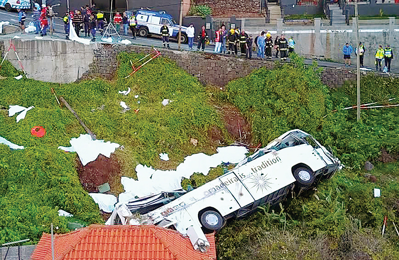 CANICO, Portugal: A video grab shows the wreckage of a tourist bus that crashed on April 17, 2019 in Canico, on the Portuguese island of Madeira. — AFP