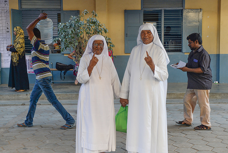 TAMIL NADU: Indian nuns display their ink-marked fingers after casting their vote at a polling station in Chennai yesterday during the second phase of the mammoth Indian elections. —AFP