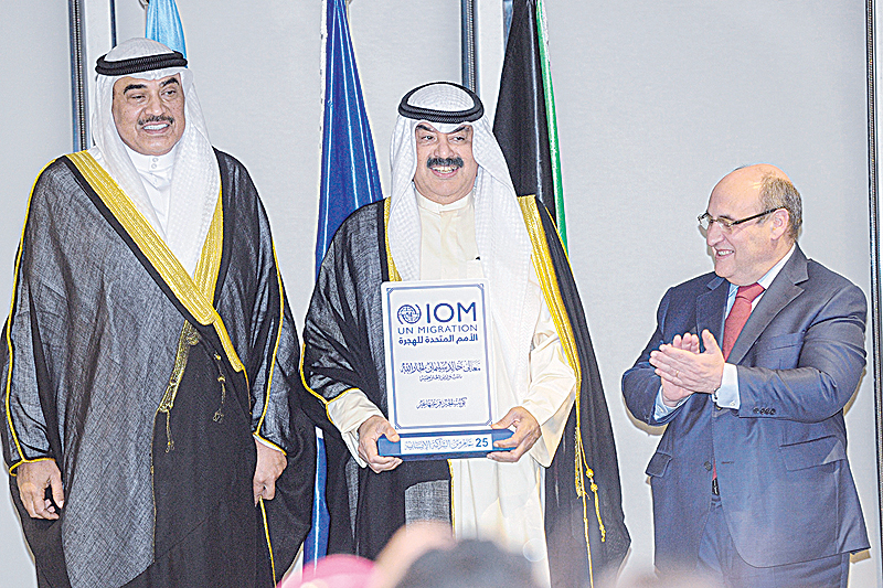 KUWAIT: Director-General of IOM Antonio Vittorino (right) honors Deputy Foreign Minister Khaled Al- Jarallah (center), as Deputy Prime Minister and Minister of Foreign Affairs Sheikh Sabah Al-Khaled Al- Hamad Al-Sabah looks on. —KUNA
