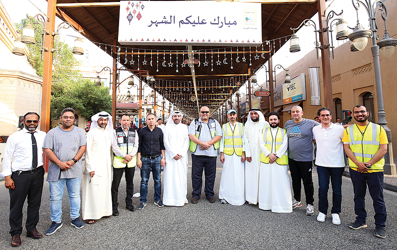 KUWAIT: Meshaal Al-Nasari, Abd Al-Rahman Al-Alyan, Ayman Al-Mutairi, Salem Al-Hamar and other volunteers pose for a group photo after the event. - Photos by Yasser Al-Zayyatn