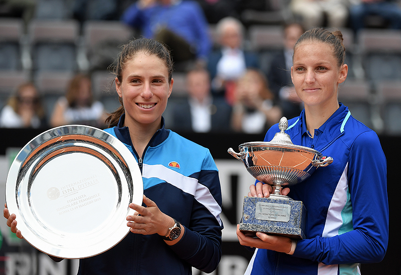 ROME: Czech Republic's Karolina Pliskova (R) poses with the trophy after winning against Britain's Johanna Konta (L) the WTA Masters tournament final tennis match at the Foro Italico camp in Rome, yesterday. - AFP