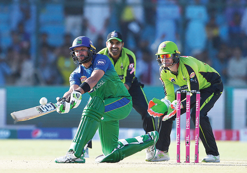 KARACHI: File photo shows, Pakistani cricketer of Multan Sultans Shahid Afridi (L) plays a shot during the third match between the Lahore Qalandars and Multan Sultans of the last eight matches of the Twenty20 Pakistan Super League (PSL). — AFP