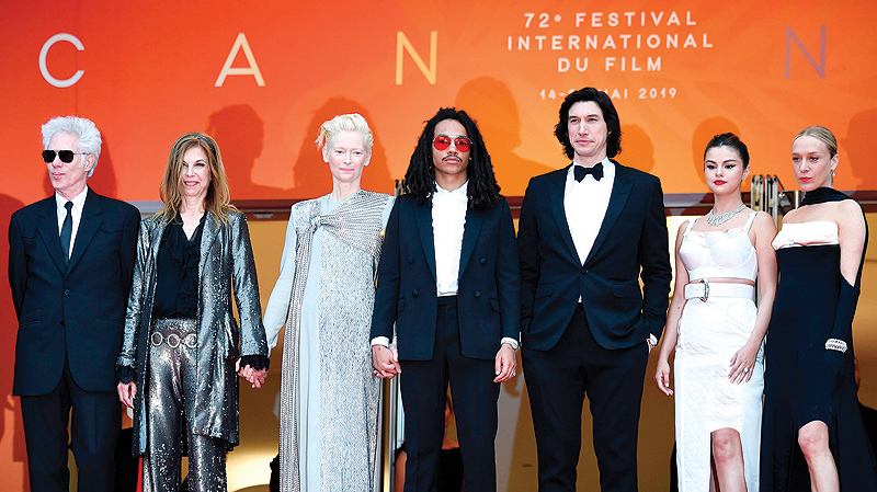From left to right, US film director Jim Jarmusch and his partner Sara Driver, British actress and model Tilda Swinton, US actor Luka Sabbat, US actor Adam Driver, US singer and actress Selena Gomez and US film actress Chloe Sevigny pose as they arrive for the screening of the film ‘The Dead Don’t Die.’